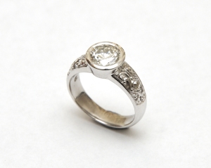 White gold and diamond, engraved engagement ring.